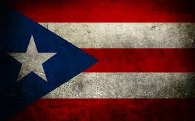 El mitin del 9 de septiembre y el viaje a Puerto Rico