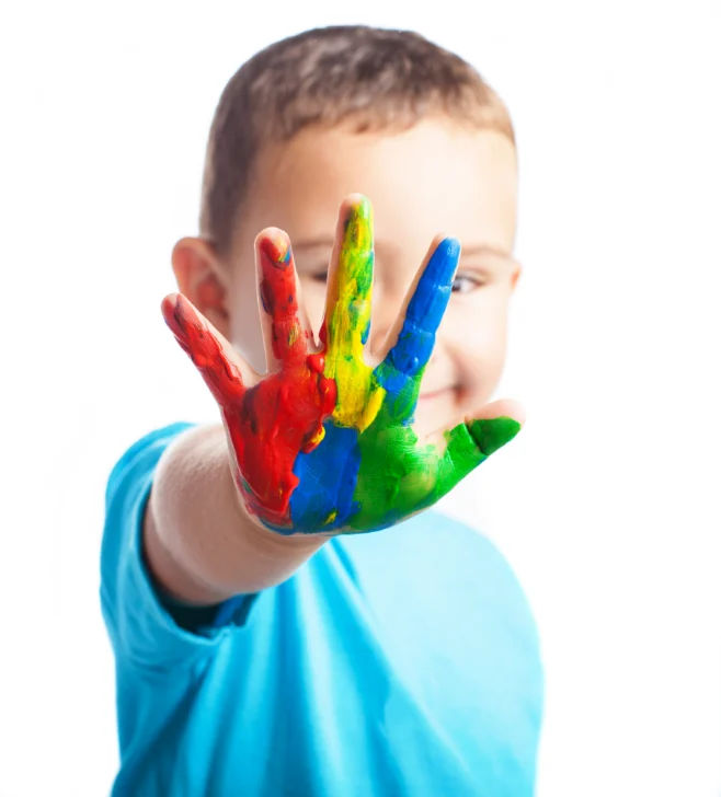little-boy-with-hand-full-paint-covering-his-face-658x728